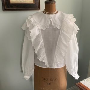 White ruffled blouse